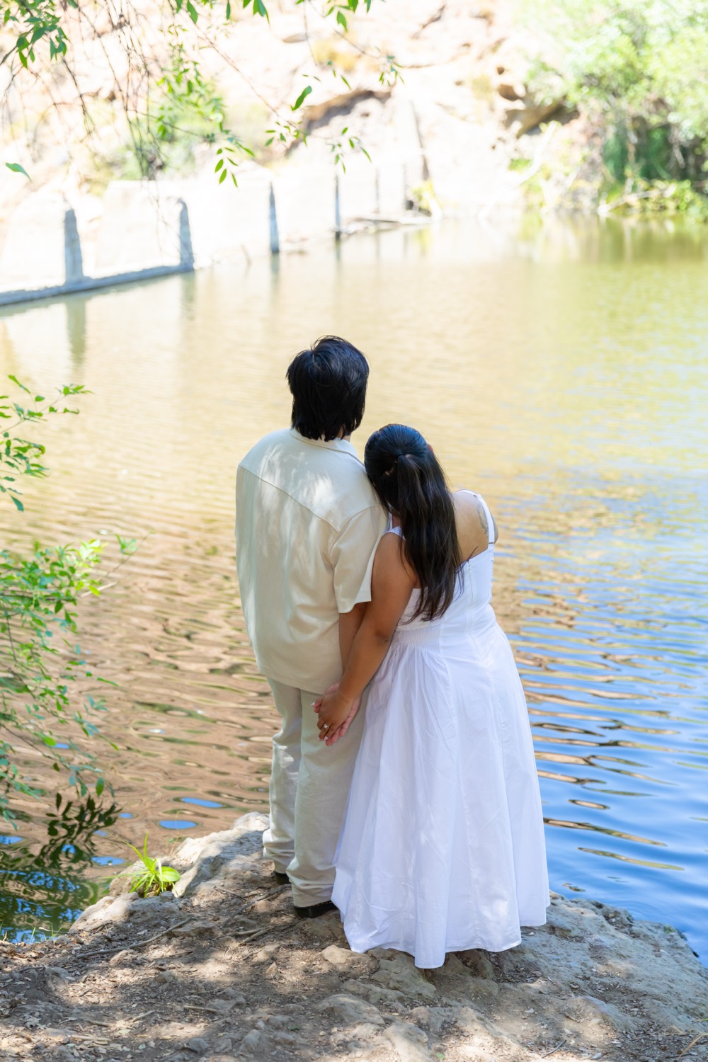 Monique and Neal looking out over a pond together